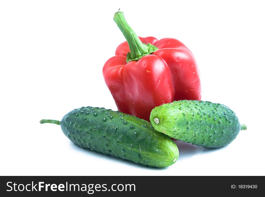 Cucumber and sweet pepper isolated on white