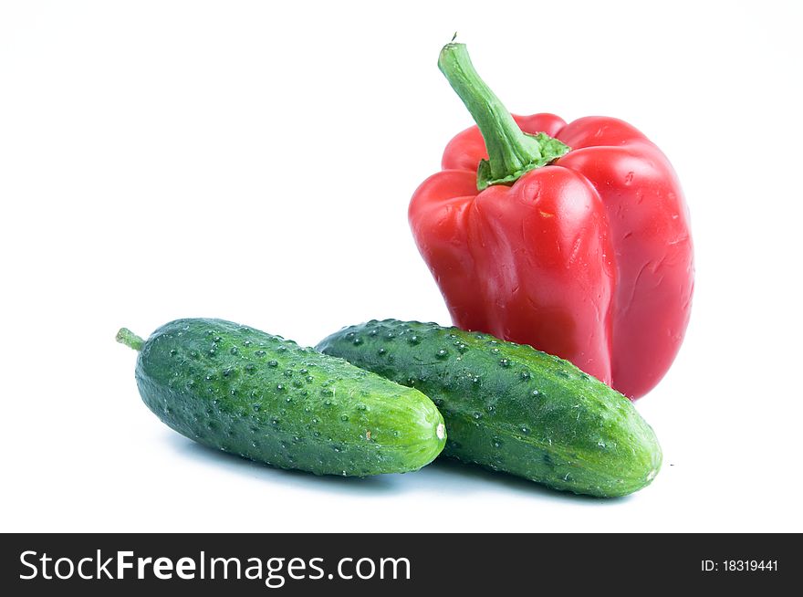 Cucumber and sweet pepper isolated on white