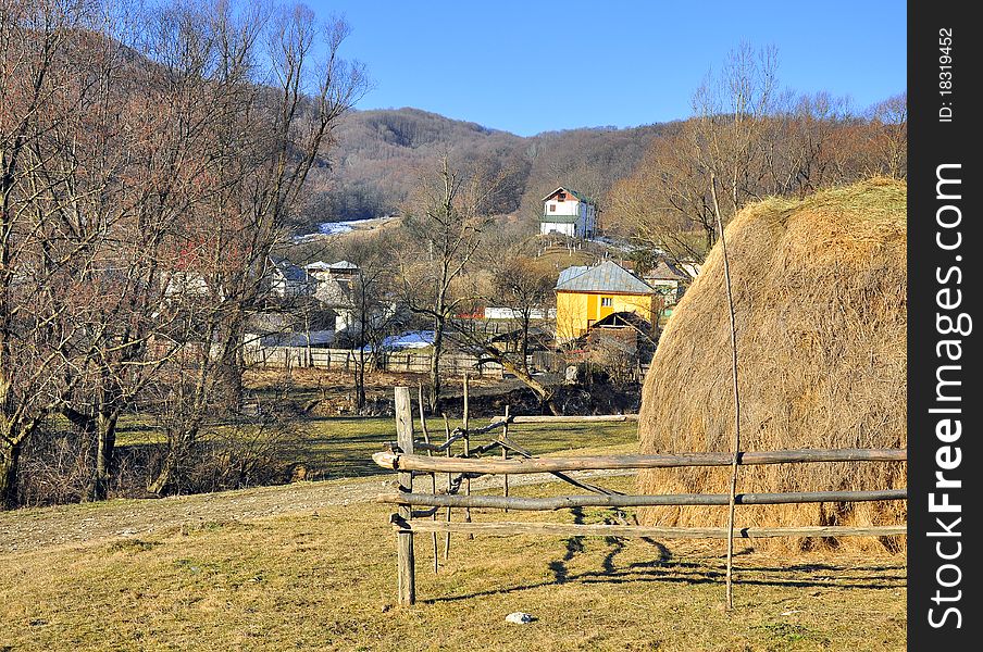 Village landscape and haycock on agriculture land