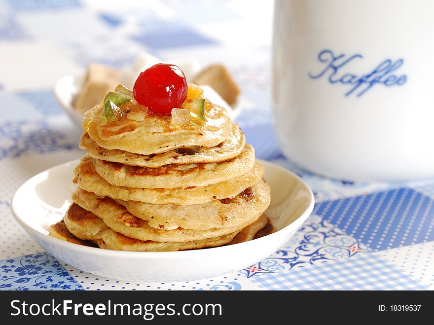 Pancakes with cup of coffee on a table. Pancakes with cup of coffee on a table