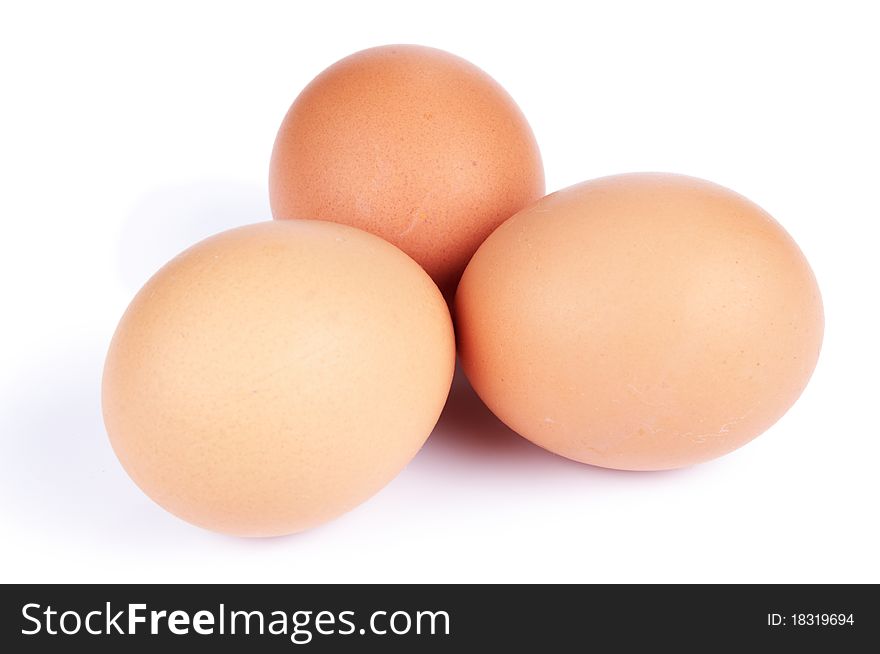 Three hen's eggs laying on white. Three hen's eggs laying on white