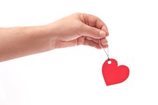 Hand With Red Heart Tag Stock Photos