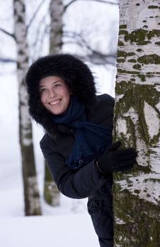 Young Girl Looks Out From The Tree Stock Photography Young Girl Looks Out From The Tree Stock Photography