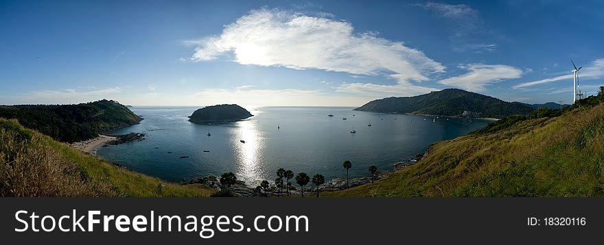 A pano stack with 5 images from the Panthep Cape in Phuket Thailand aginst the sun