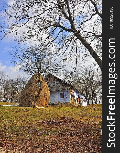 Haycock and old house in generic transylvania village