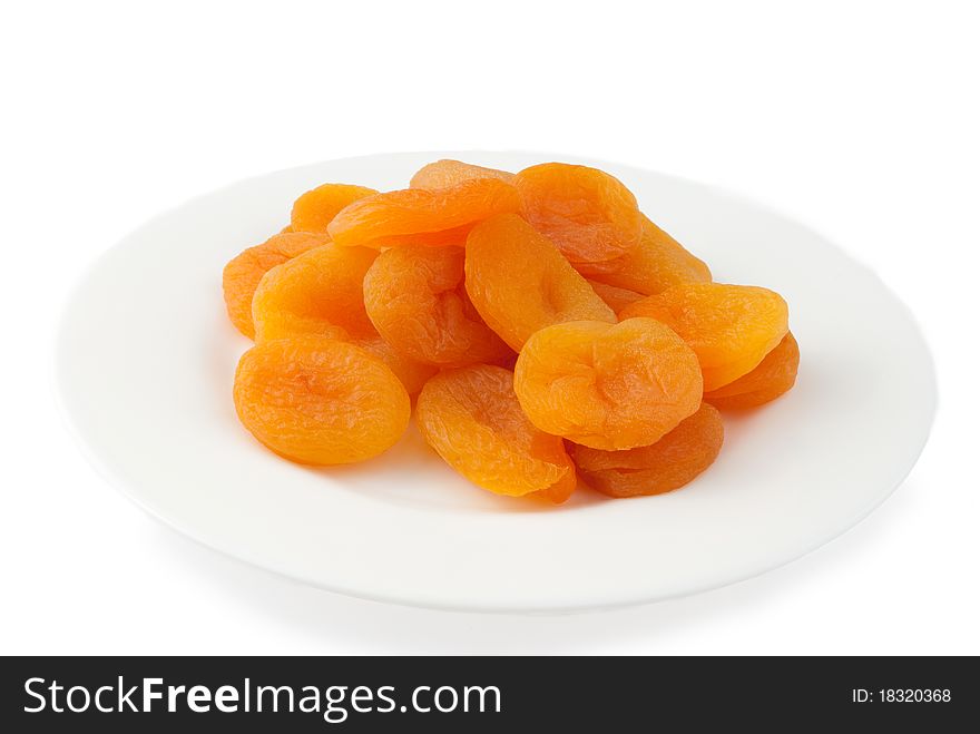 Apricots halves on white plate