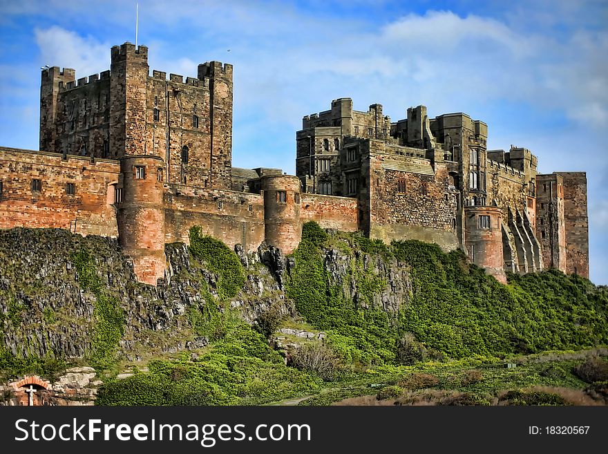 Bamburgh castle detailed architecture in dramatic position. Bamburgh castle detailed architecture in dramatic position