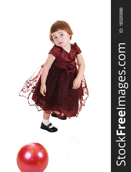 A sweet little girl, three years old, in a nice burgundy dress having fun, for white background. A sweet little girl, three years old, in a nice burgundy dress having fun, for white background.