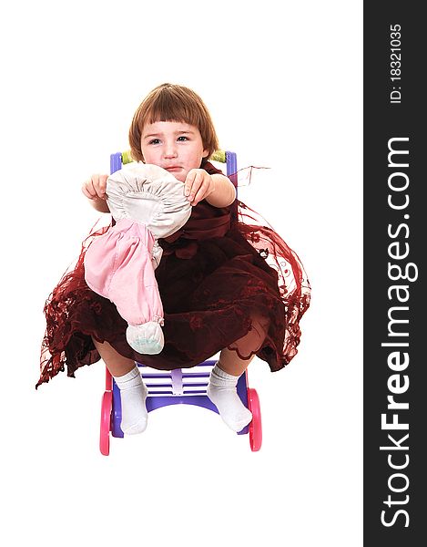 A sweet little girl, three years old, in a nice burgundy dress having fun with her stuffed animal, for white background. A sweet little girl, three years old, in a nice burgundy dress having fun with her stuffed animal, for white background.