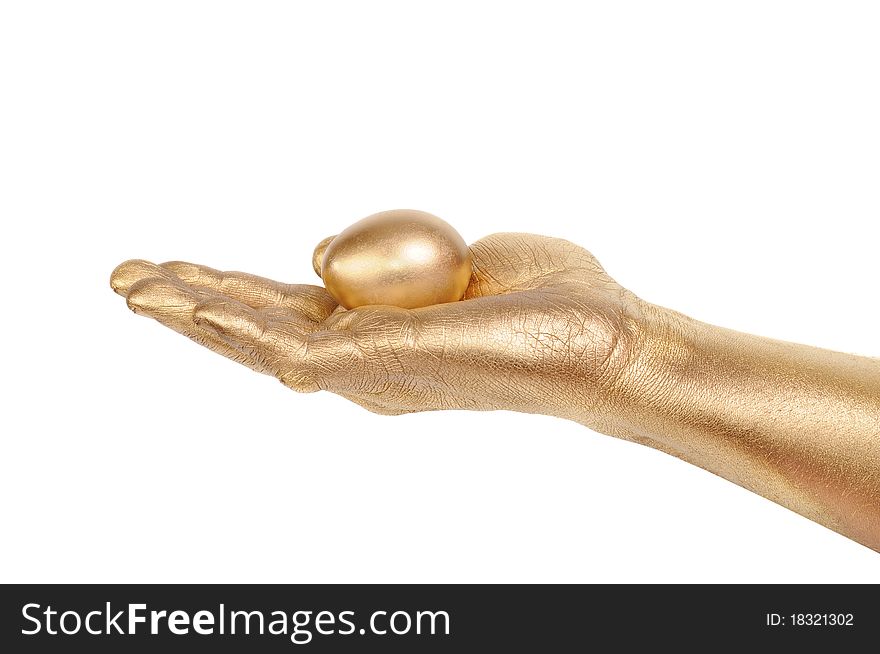 Gold egg in a gold man's hand. Isolated on white