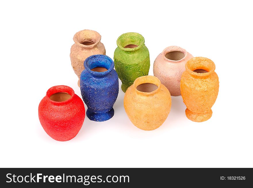 Seven multicolor vases over white