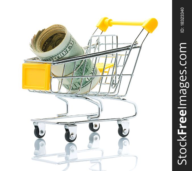 Dollars in the shopping cart on white background