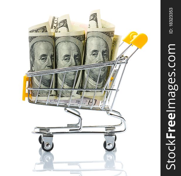 Dollars in the shopping cart on white background