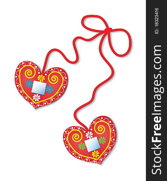 Two colorful gingerbread hearts decorated with flowers and mirrors. Two colorful gingerbread hearts decorated with flowers and mirrors.