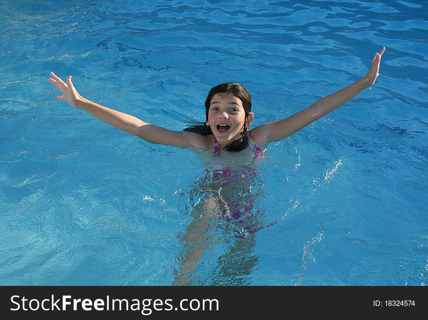 Girl making a splash in the water. Girl making a splash in the water.