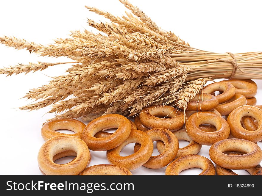Bagels with wheat ears on white