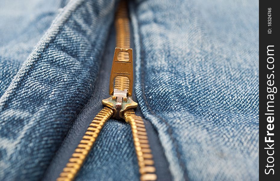 Detail of zipper on blue jeans