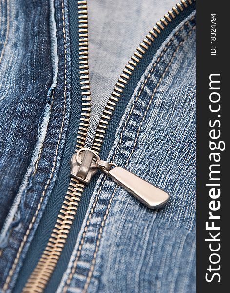 Detail of zipper on blue jeans