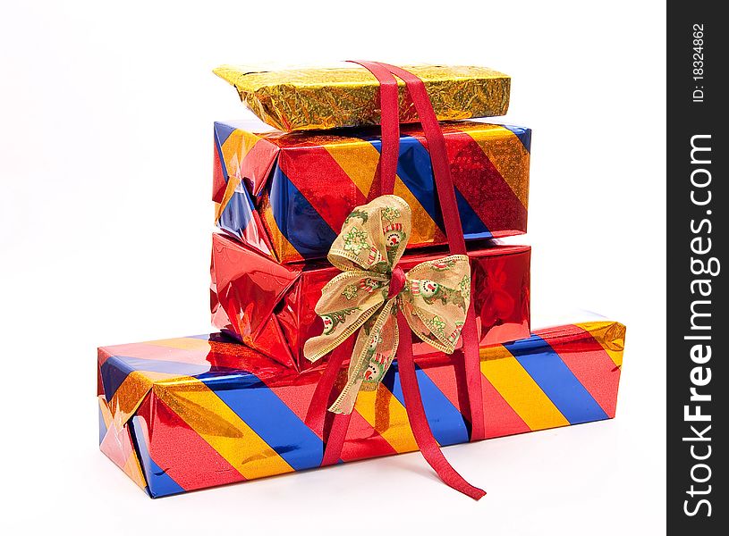 Stack of gift boxes with bow on white