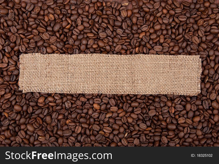 Burlap tag on the background of coffee