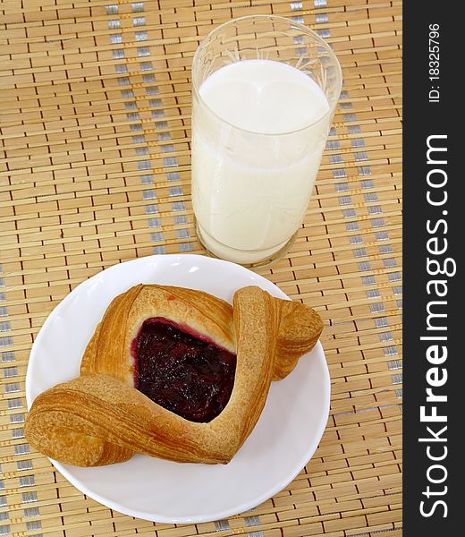 Fruit puff pastry with milk. Breakfast