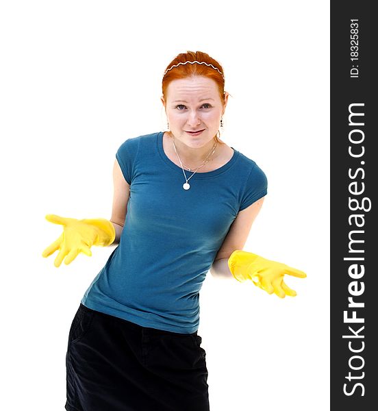 Redhead young woman with yellow gloves as a housewife