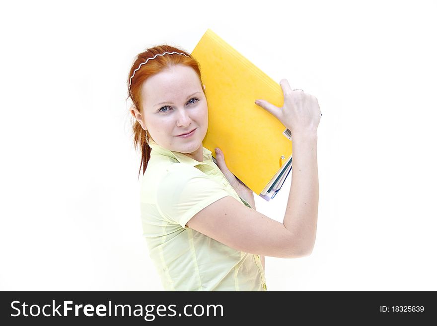 Redhead young woman student holding a notebooks isolated