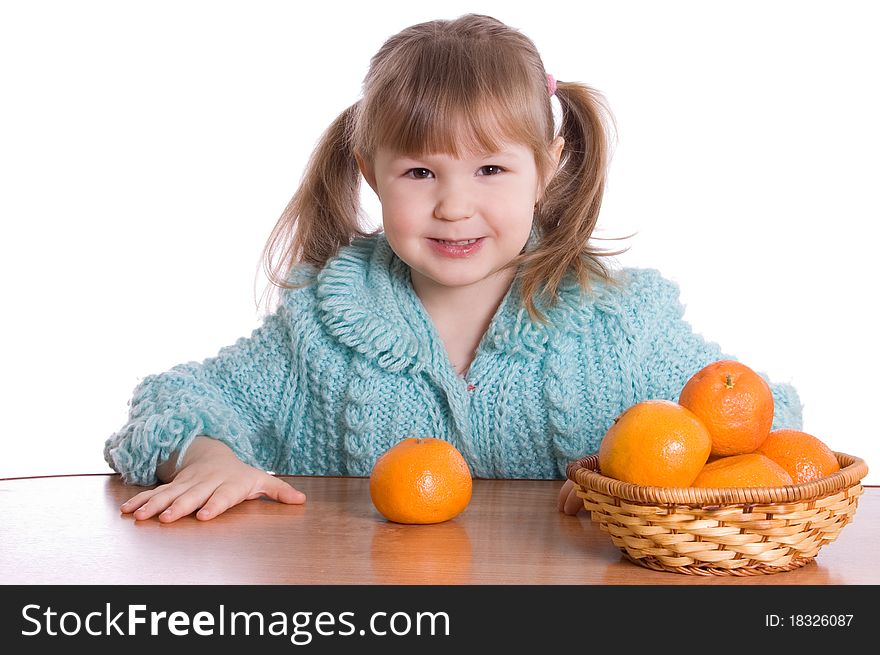 The little girl with tangerines on white