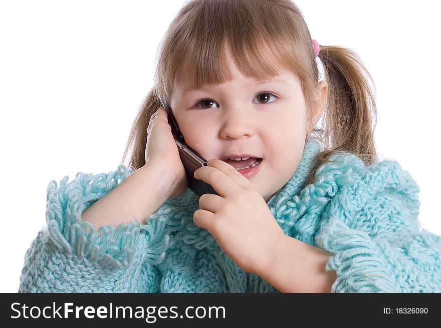 The little girl speaks by phone on white