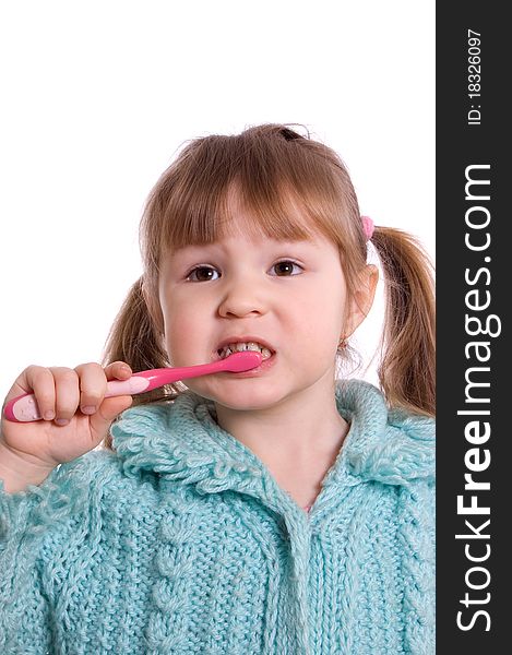 The little girl cleans a teeth on white