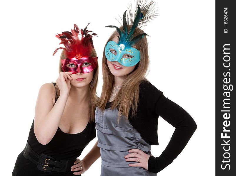 Two girl in the masquerade mask on a white background