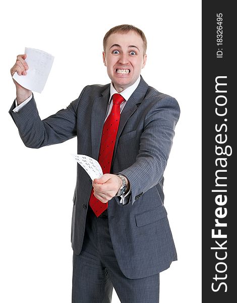 Young businessman in a rage tearing paper