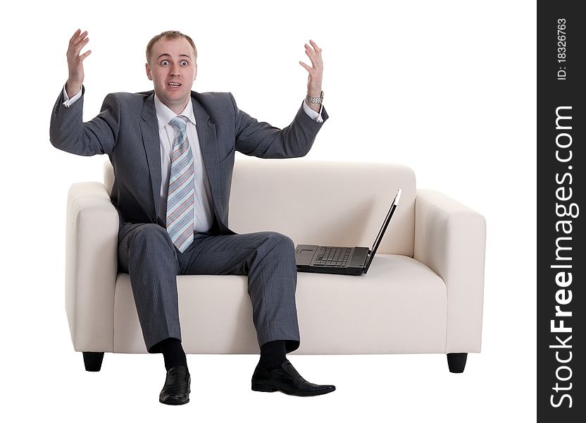 Businessman on the couch with a laptop