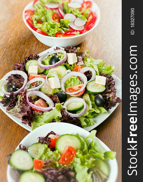 Healthy fresh salad setting on table.