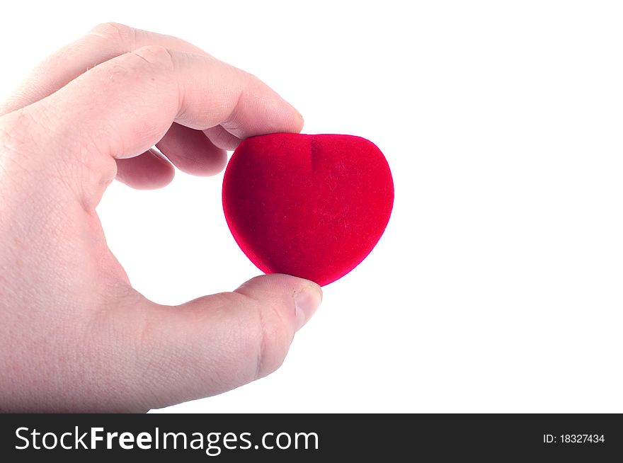 Plush heart in human fingers. Plush heart in human fingers