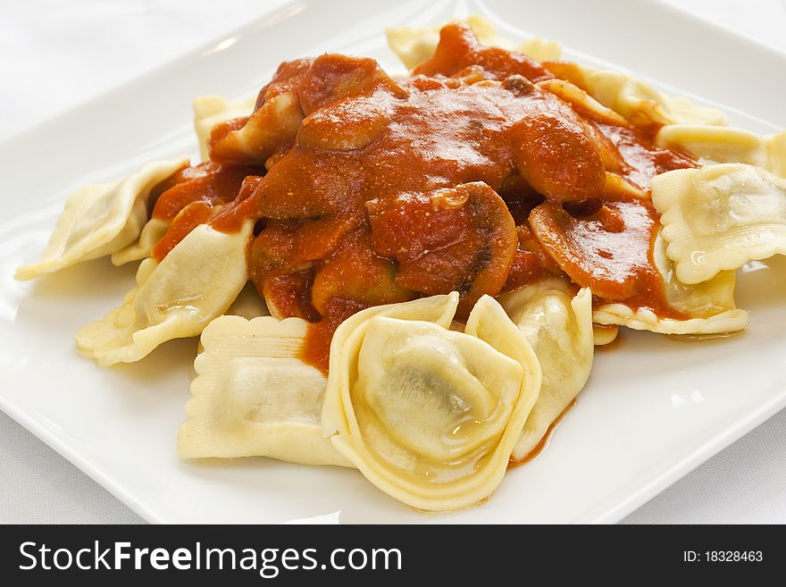 Ravioli, Italian pasta, with cherry tomato sauce. Ravioli, Italian pasta, with cherry tomato sauce