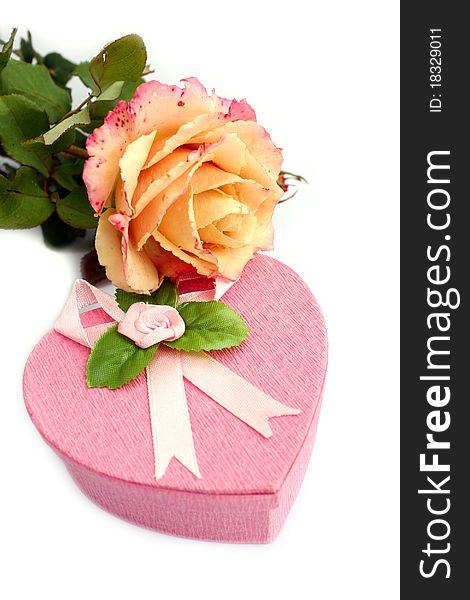 Close-up isolated heart-shaped gift box with rose on it