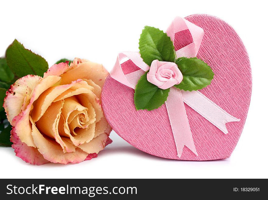 Close-up isolated heart-shaped gift box with rose near