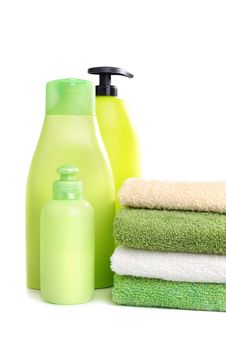 Towels And Green Plastic Bottles Royalty Free Stock Photography Towels And Green Plastic Bottles Royalty Free Stock Photography