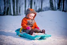 Serious Baby Sliding On Sleigh From Hill Stock Image Serious Baby Sliding On Sleigh From Hill Stock Image
