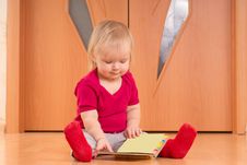 Baby Sit On Floor And Read Baby Book Stock Photography Baby Sit On Floor And Read Baby Book Stock Photography
