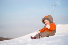 Adorable Baby Sit On Mountain Side On Sunset Stock Photo