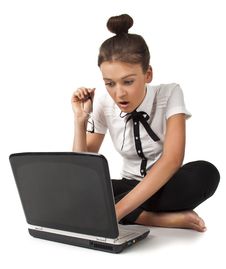 Girl Sitting On The Floor And Works On A Laptop Stock Images Girl Sitting On The Floor And Works On A Laptop Stock Images