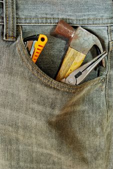 Repairman Jean With Tool In Pocket Royalty Free Stock Photography