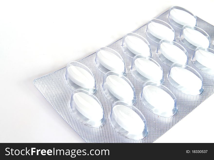 Blister pack of pills isolated on white