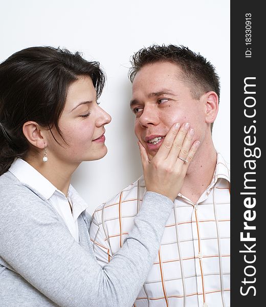Young woman touches her husband's face. Young woman touches her husband's face