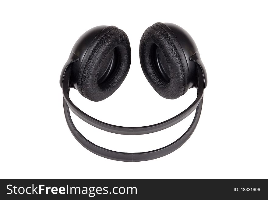 Big black headphones lying on a white background