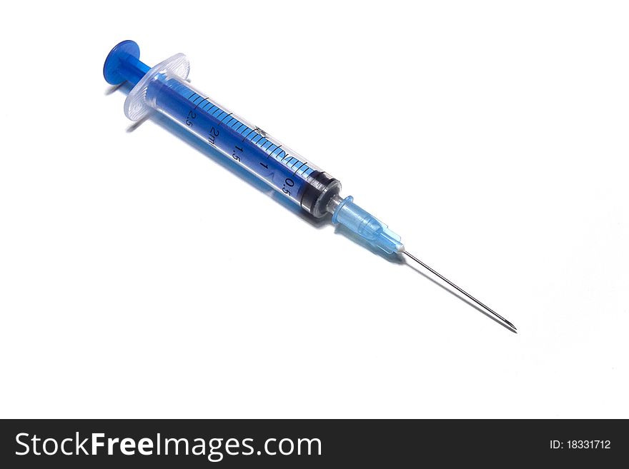 Dark blue plastic disposable syringe on a white background. Dark blue plastic disposable syringe on a white background