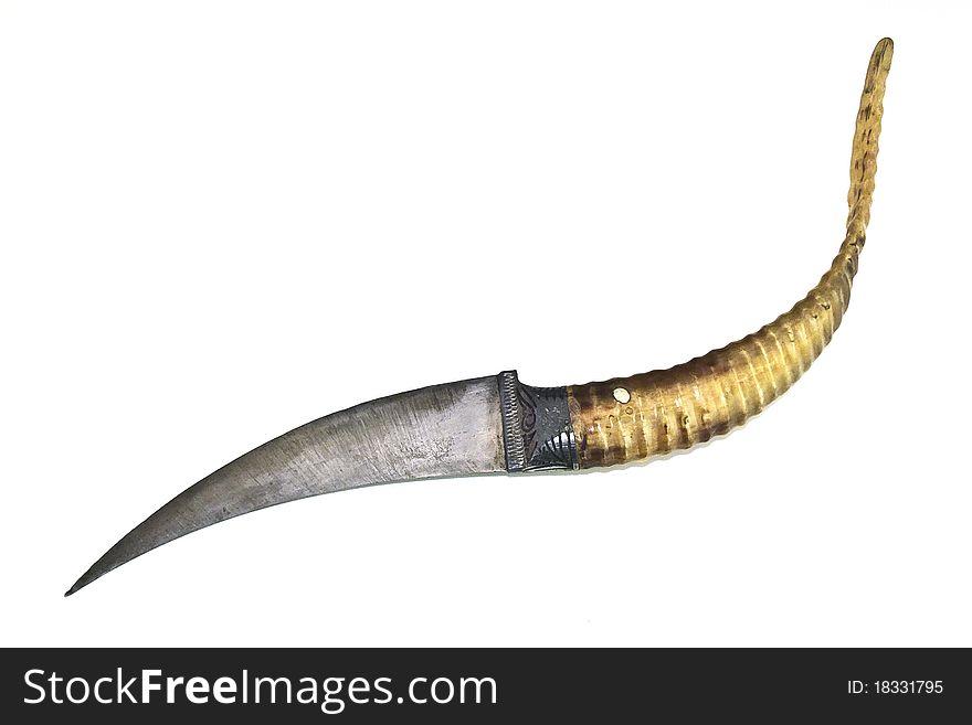 A decorative dagger without its sheath on a white background