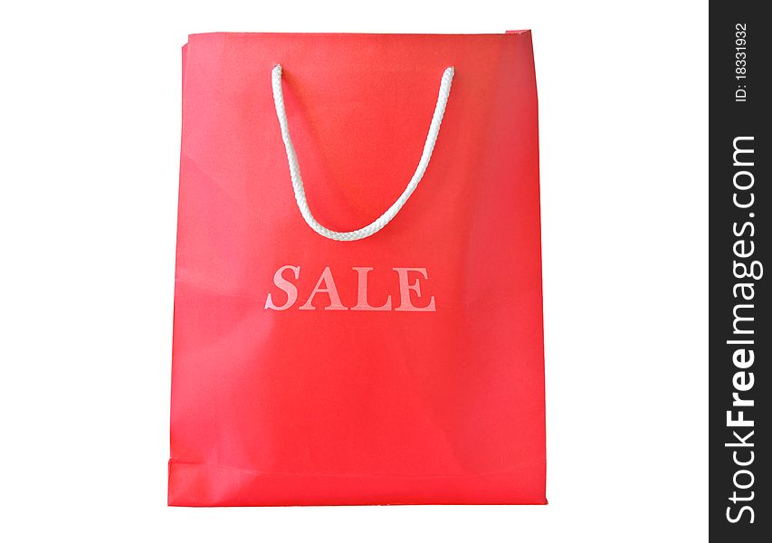 Red shopping paper bag with handles and sale text isolated on white background. Red shopping paper bag with handles and sale text isolated on white background